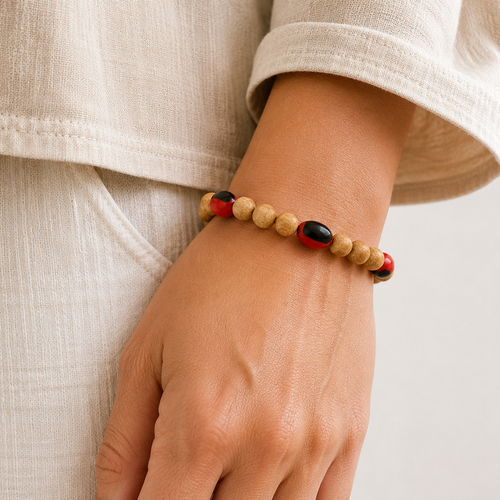 Handcrafted Palo Santo and Huayruro seed bracelet from Peru