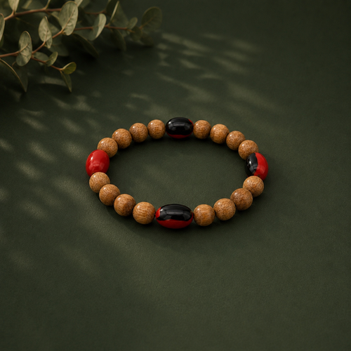 Handcrafted Palo Santo and Huayruro seed bracelet from Peru
