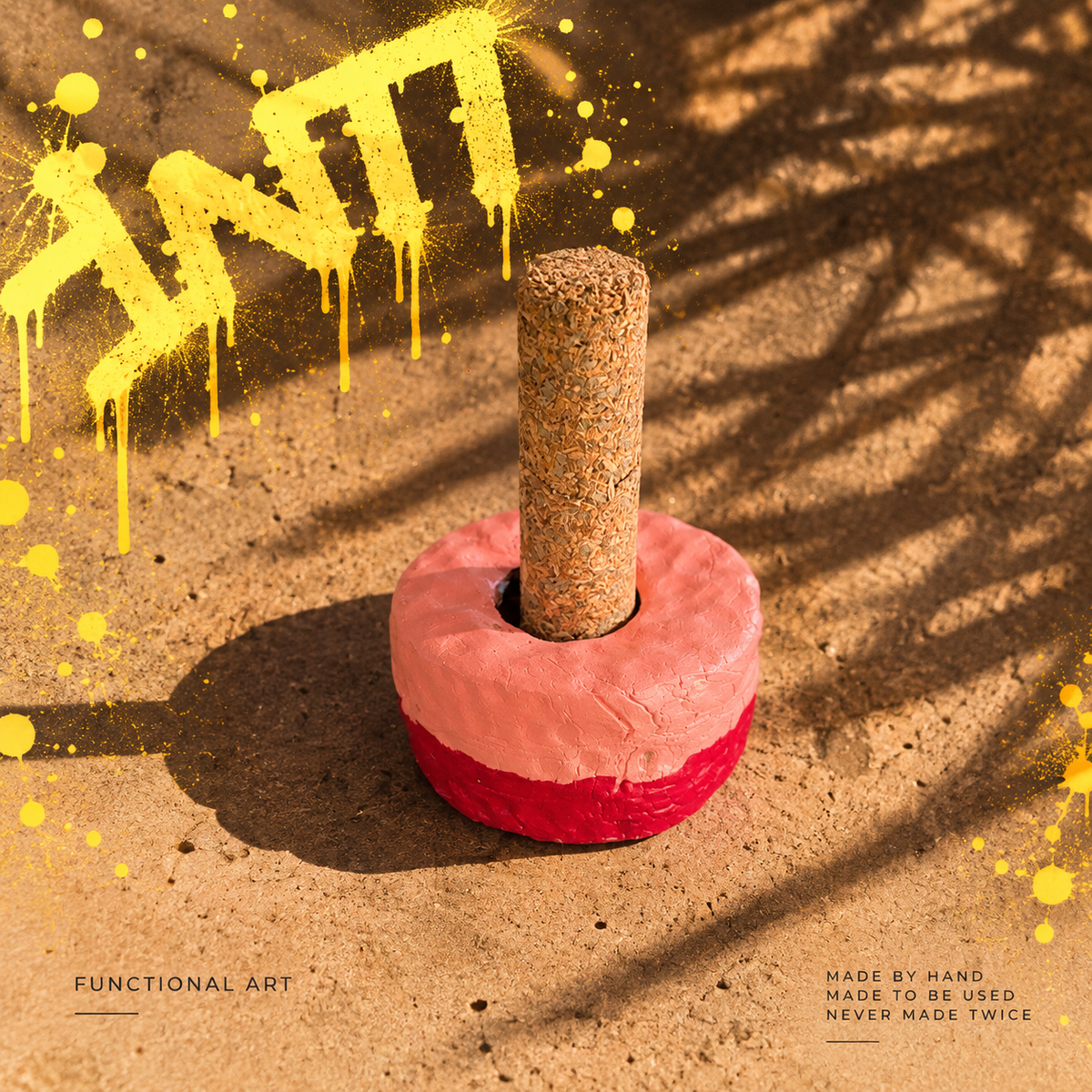 Second view of INTI 010, a handmade incense holder in coral pink with a red base
